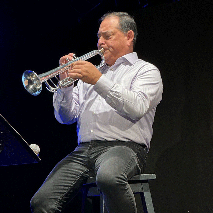 David Spencer playing the saxophone.